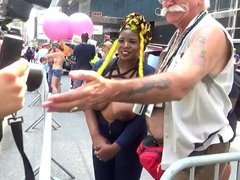 Busty Ebony poses with random guys on the street