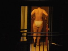 MILF neighbor topless at night