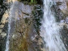Hot guy and 2 sexy girls have a threesome next to a waterfall